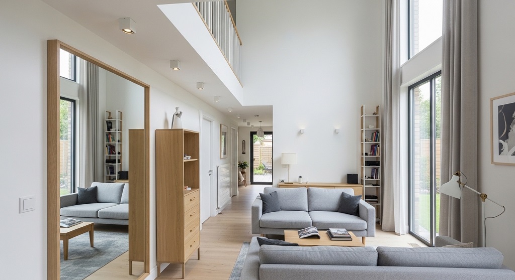 small living room with mirrors and light wall colors creating spacious effect