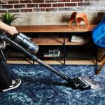 Lightweight cordless stick vacuum removing dirt and pet hair from carpet, highlighting strong battery life and easy maneuverability in Florida